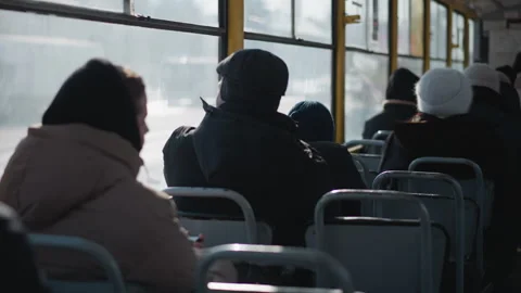 Close Back View Passengers Seated in Moving Bus with Transparent Windows Stock Footage 318628173