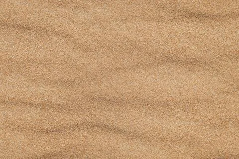 Close-up  background brown sand wave with rippled dunes. Stock Photos