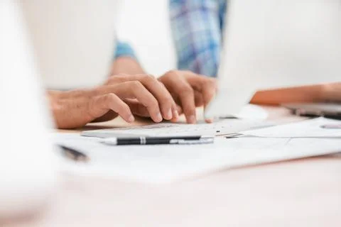 Close up. background image of employees typing on the computer keyboard Stock Photos