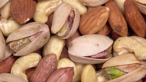 Close up. background of nuts. different types of nuts rotate in a circle Stock Footage 169329019