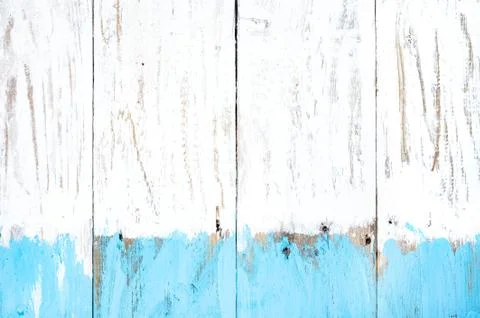 Close-up  of  background from old planks colored with white and blue  paint . Stock Photos
