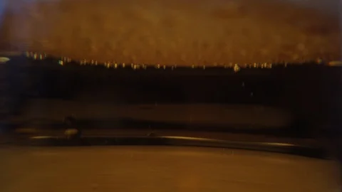 Close up background of pouring beer with bubbles and foam in glass, low angle si Stock Footage 104934713