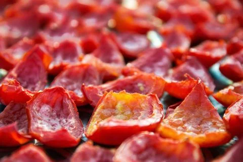 Close-up Background of Red Tomatoes Drying outdoors in the sun Stock Photos