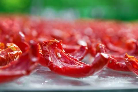 Close-up Background of Red Tomatoes Slice Drying outdoors on a sunny day Stock Photos