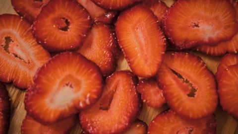 A close-up background of sliced strawberries. A close-up shot of fresh slice Stock Footage 346393453