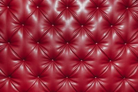 Close up background texture of red genuine leather, classic retro Chesterfield Stock Photos