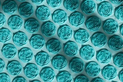 Close up background texture of turquoise plastic rose shape spikes on an Foto stock