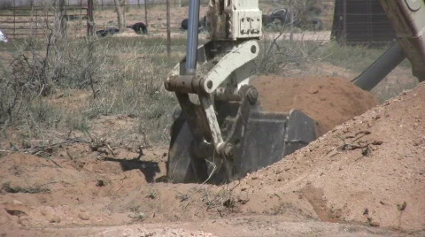 Close-up of Backhoe Digging Drain Field Stock Footage 548416
