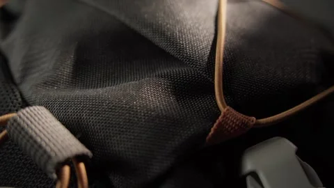 Close-up of a Backpack with Cord Loops and Plastic Buckle Stock Footage 296159125