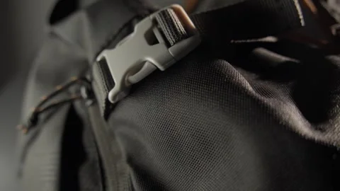 Close-up of a Backpack Strap with Plastic Buckle in Detail Stock Footage 296159468
