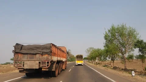 Close backside view of truck running on national highway Stock Footage 151958132