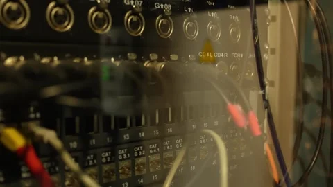 Close-up of a backstage theater audio patch panel with plugged-in cables Stock Footage 334013315