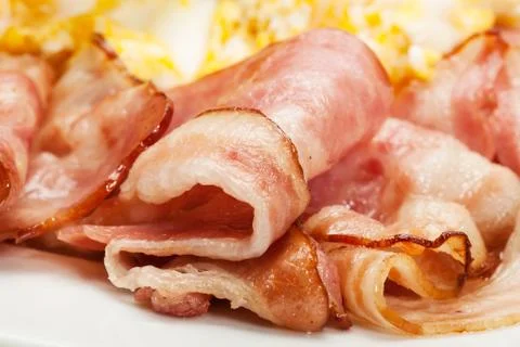 Close-up bacon and scrambled eggs. selective focus. Stock Photos