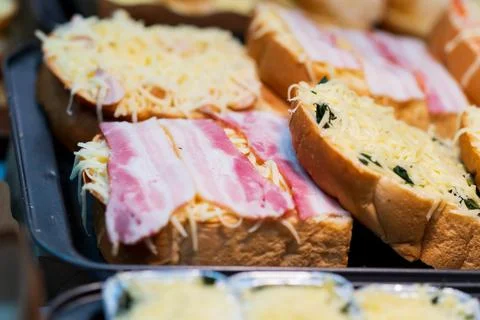 Close up of bacon bread with Cheese, thai street food market Stock Photos