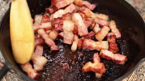 Close Up of Bacon Cooking in Cast Iron Pan Stock Footage 280121765