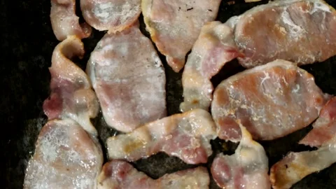 Close-up of bacon frying on a barbecue Stock Footage 325450930