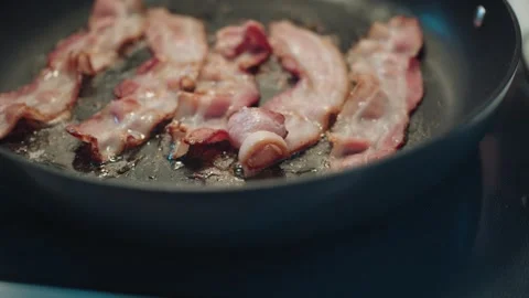 Close-up of Bacon Frying in a Pan Stock Footage 317530120