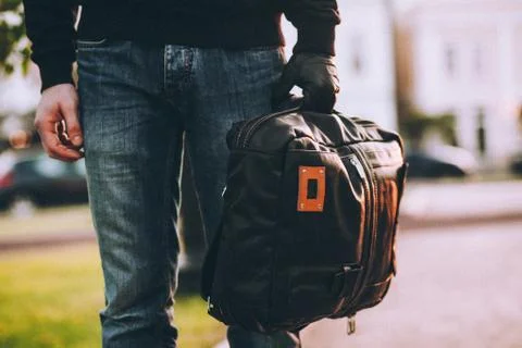 Close-up of bag being held by gloved hand of robber Stock Photos