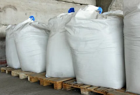 Close-up of bags of sugar in the warehouse of the processing plant. 스톡 사진