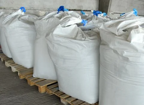 Close-up of bags of sugar in the warehouse of the processing plant. Stock Photos