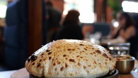 Close-up of baked bread dish in restaurant Stock Footage 345979933