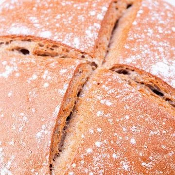 A close-up of baked bread dusted with flour Stock Photos