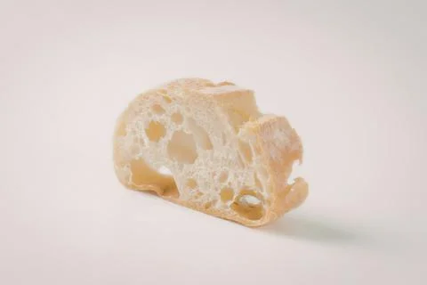 Close-up of baked bread slice with holes Stock Photos