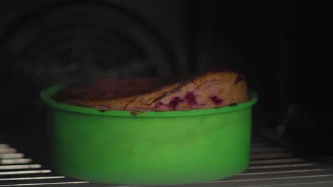 Close-up, Baked Cake for Cake Stands in Plastic Form in the Oven Stock Footage 139936931