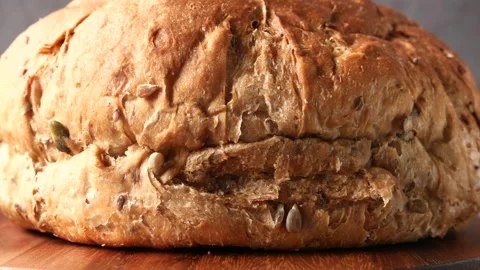 Close up of baked round shape baked bread on table Stock Footage 151836457