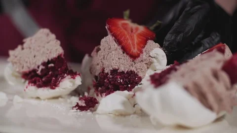 Close up of baker cutting cake with cream and strawberry in slow motion Stock Footage 106707415