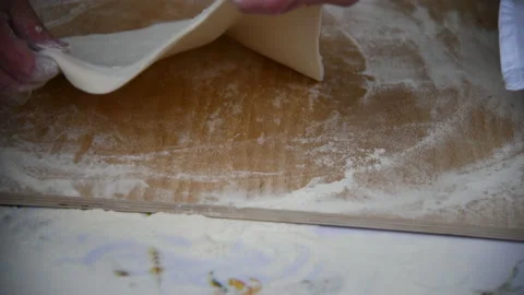 Close up of a baker kneading with his hands to prepare the bread to put in th Stock Footage 172435848