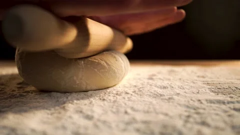 Close up of baker or chef preparing fresh dough on kitchen table. Stock Footage 137748835