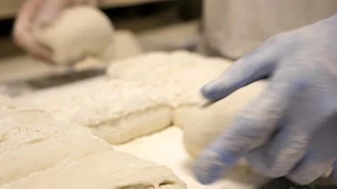 Close up of a baker's hands preparing dough for bread Stock Footage 147065534