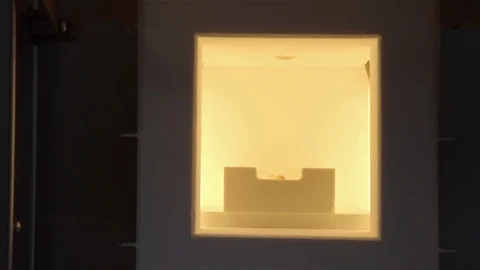 Close up of baking artificial teeth in extremely high temperature oven Stock Footage 106943252