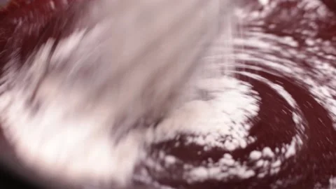 Close-up of baking chocolate stirring, mixing melted chocolate with flour Stock Footage 237165432