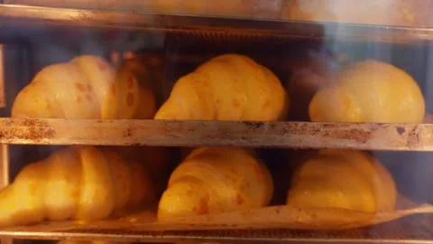 Close-up of baking croissants in the oven. Stock Footage 313533045