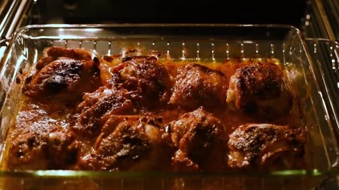Close-up of baking hot grill chicken legs in the oven. Video stock 167549299