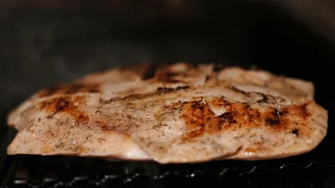 Close-up of baking hot grill chicken on the grill. Roasted chicken meat Stock Footage 202204516