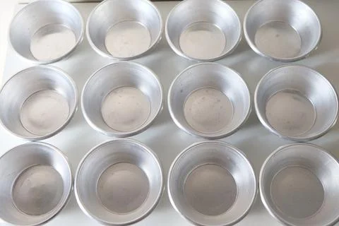 Close up of baking utensils. Pie and cake molds. Kitchen tools. Stock Photos