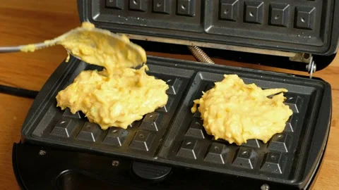 Close-up of baking vegetable waffles  at home. Healthy pumpkin waffles. Stock Footage 235275782
