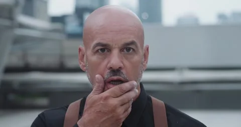 Close-up bald man with goatee looking up with expression genuine surprise face Stock Footage 275871569