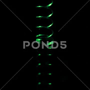 Close-up ball pen spring against a black background Stock Image #154112656