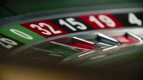 Close-up the ball is spinning on a roulette wheel in a casino Stock Footage 195343305