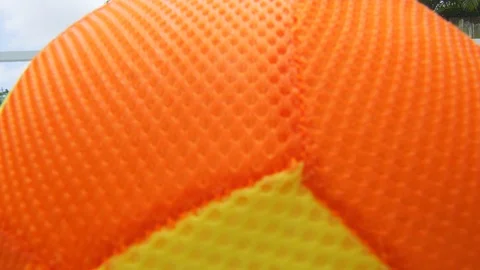 Close-up of ball in swimming pool as it is thrown to kids Stock Footage 113036473