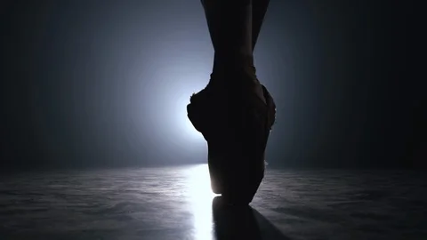 Close up of ballet dancer's feet in pointe warmed up before performing on stage Stock Footage 127590516