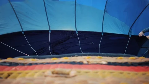 Close up of the balloon filled with gas is preparing for the flight festival Stock Footage 94266428