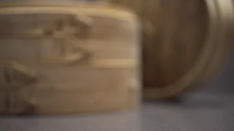 Close up of bamboo dumpling carrier. Dolly zoom.  Video stock 78884625