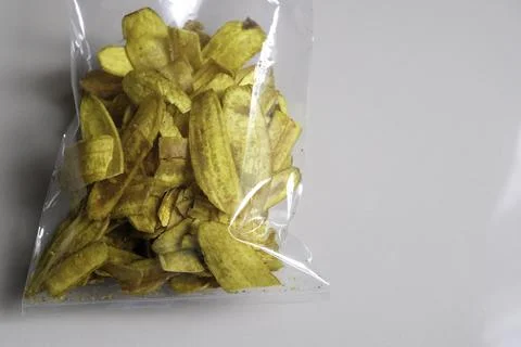 Close-up of banana chips in plastic packaging. Stock Photos