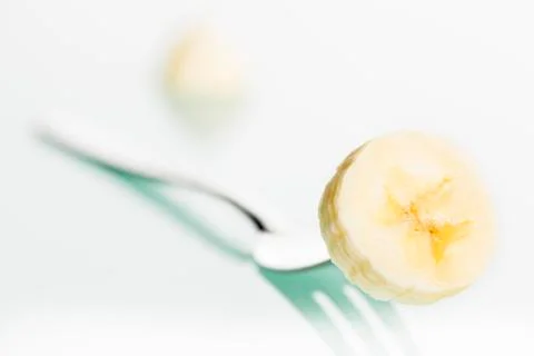 Close up of banana slice on fork. Foto stock