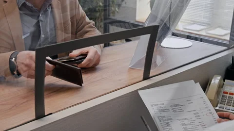 Close up of Bank Teller Handling Documents of Customer in Bank Office Stock Footage 330971898